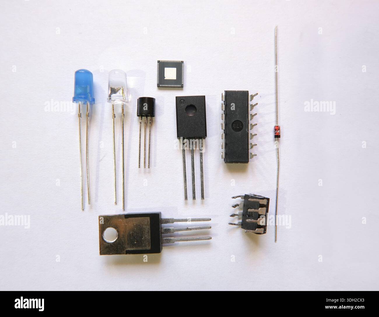 Electronic components on the table. Semiconductor elements: Transistors, integrated circuits, diodes. Stock Photo