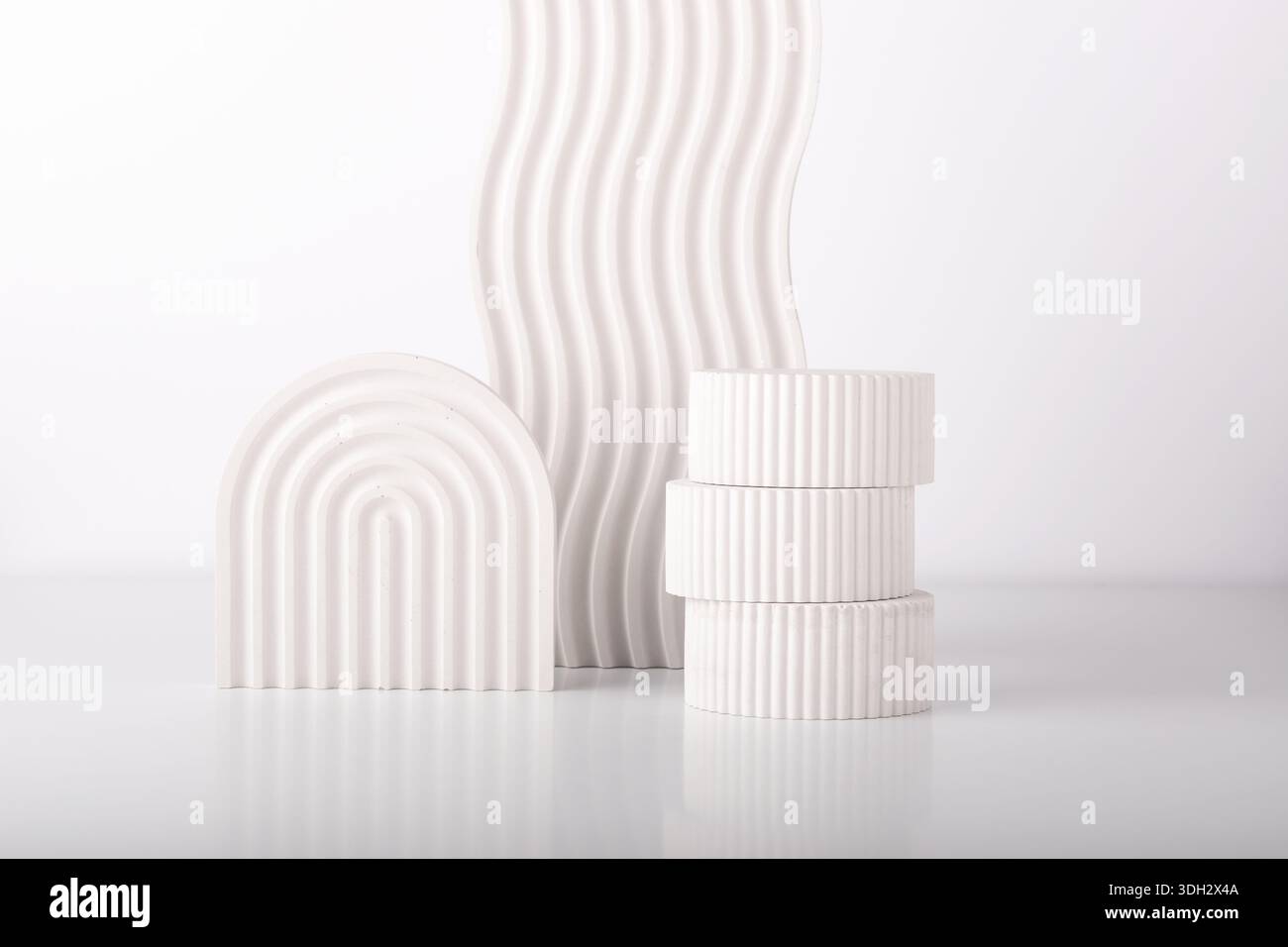 White concrete advertising stands. Gypsum podium for the presentation of cosmetic products. Minimal mock up. Stock Photo