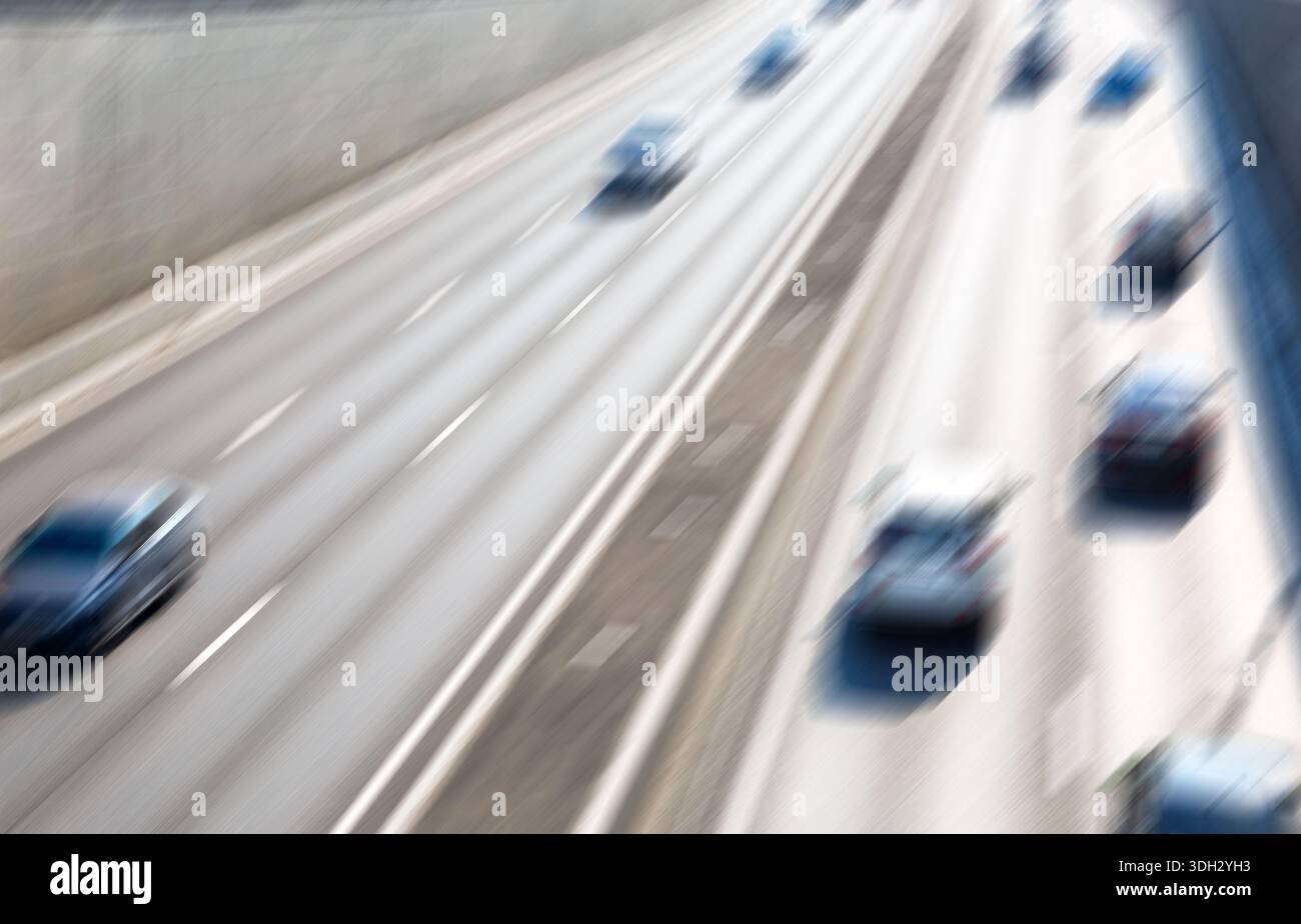 Blurred background of traffic on city street in summer Stock Photo