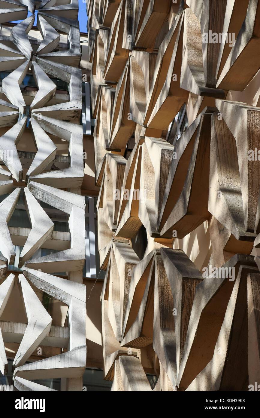 Protruding Design Facade with protruding concrete elements forming starburst designs next ...
