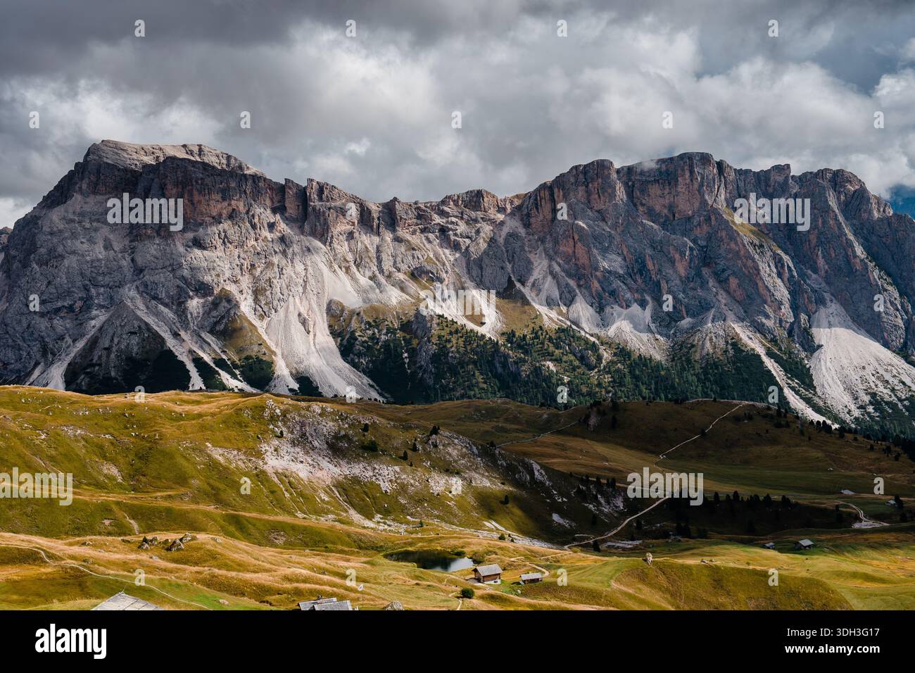 The iconic jagged peaks of Seceda rise dramatically above rolling green ...