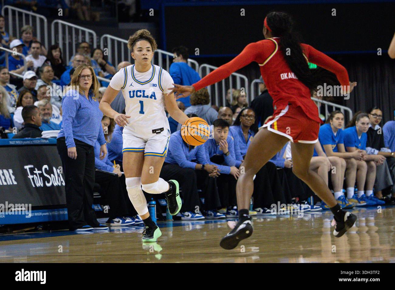 LOS ANGELES, CA - JANUARY 18: UCLA Bruins guard Kiki Rice #1 brings the ...