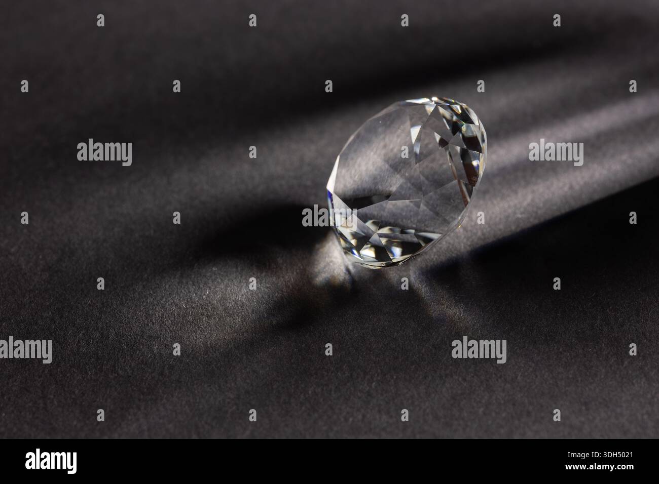 diamond on dark background close up. Stock Photo