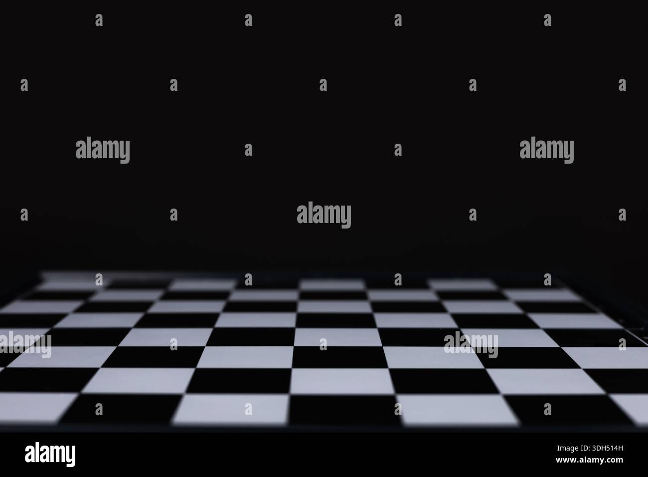empty chess board on dark background. Stock Photo