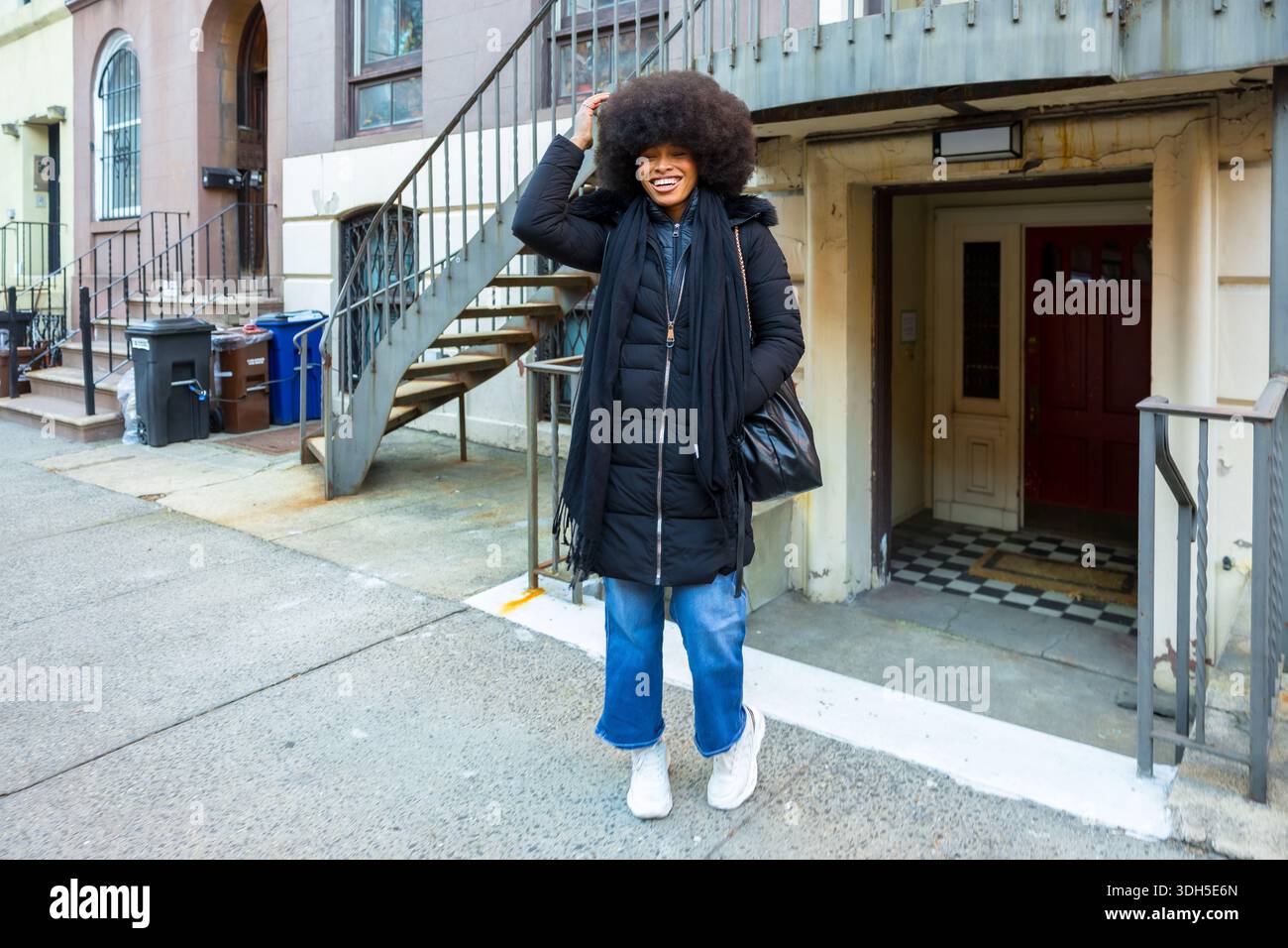 Happy young woman posing on new york city street Stock Photo