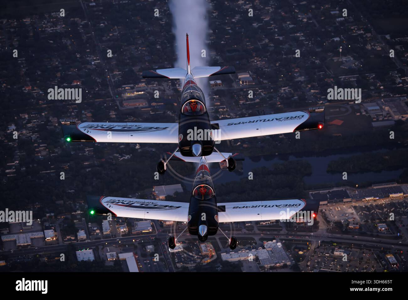 Two Van's RV-8 aircraft, registrations N552KM and N803RL, are captured ...