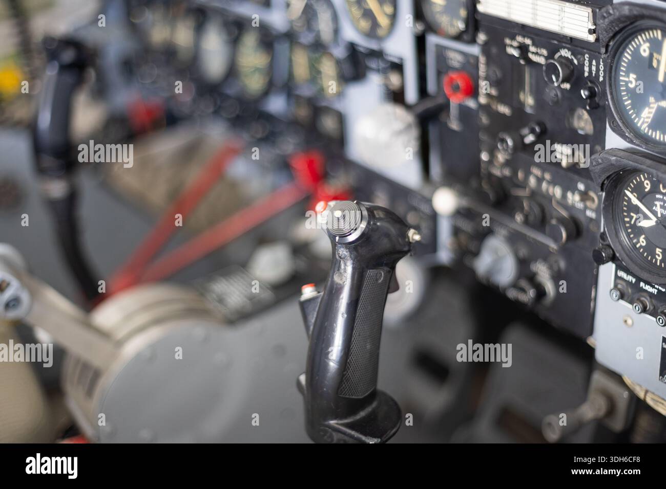 Aircraft cockpit showing flight control stick and instrument panel ...