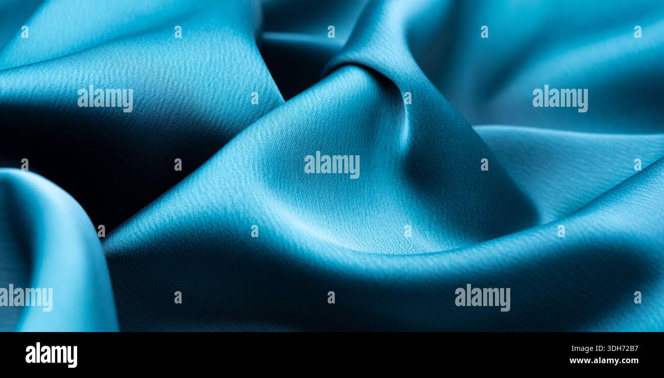 Turquoise satin texture with elegant waves Stock Photo