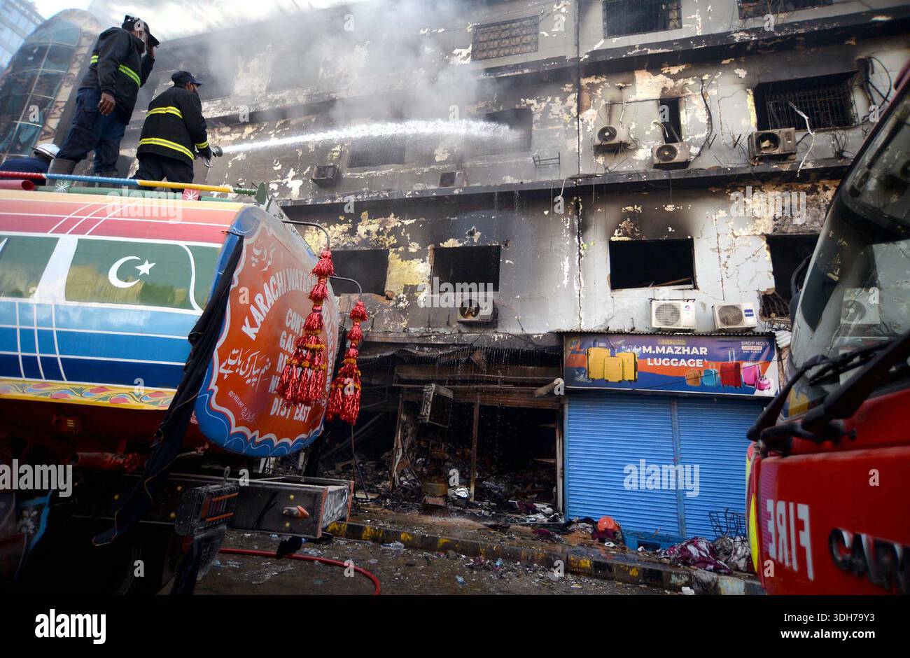 View of site after fire broken out incident at Gul Plaza shopping mall ...