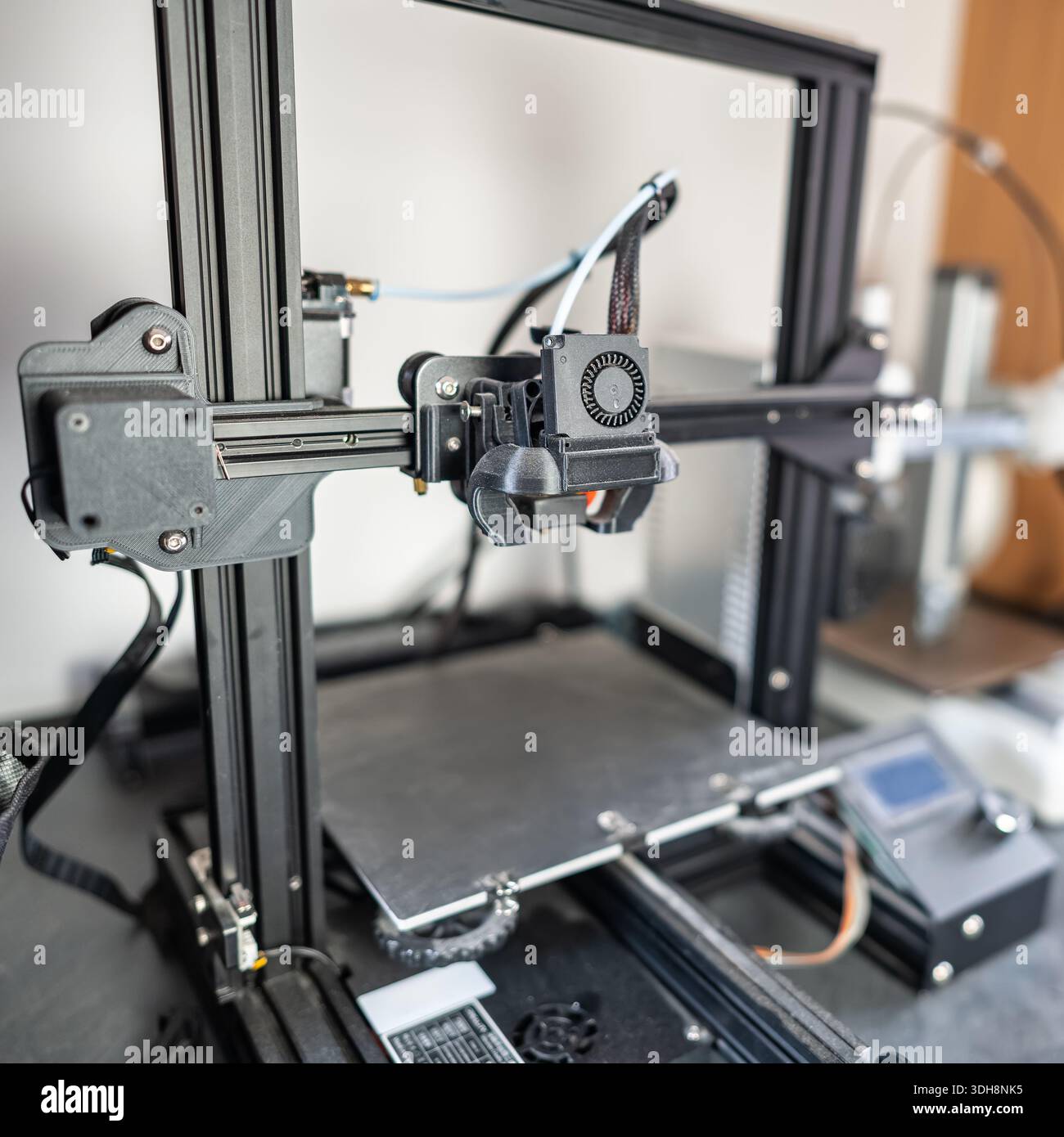 Plastic thread 3d printer with articulated head that prints medium-sized models. Stock Photo