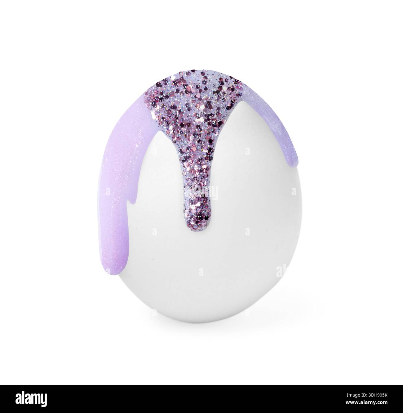 Paint with glitter dripping down egg on white background. Easter celebration Stock Photo