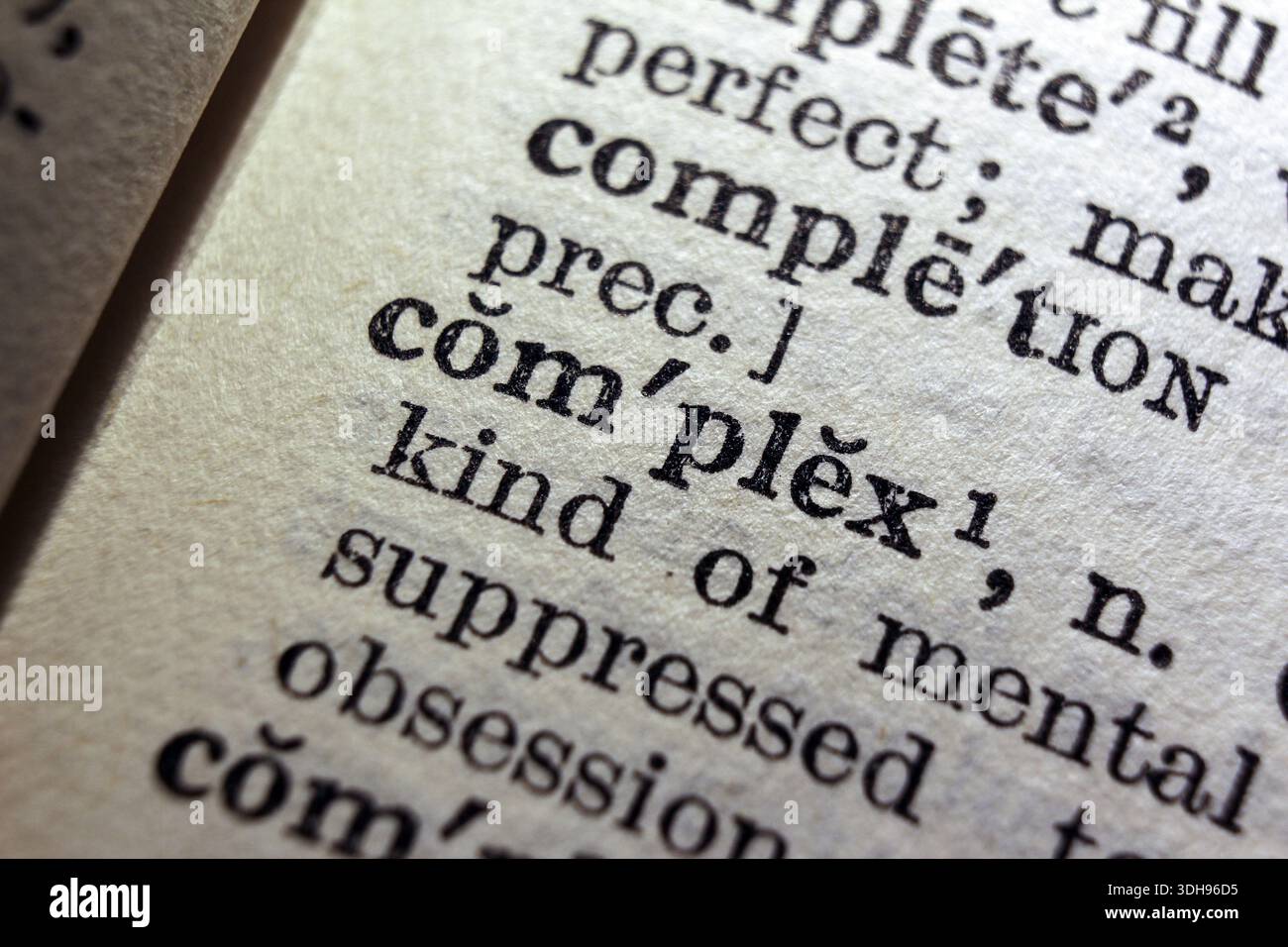 Word complex on dictionary page, macro close-up Stock Photo