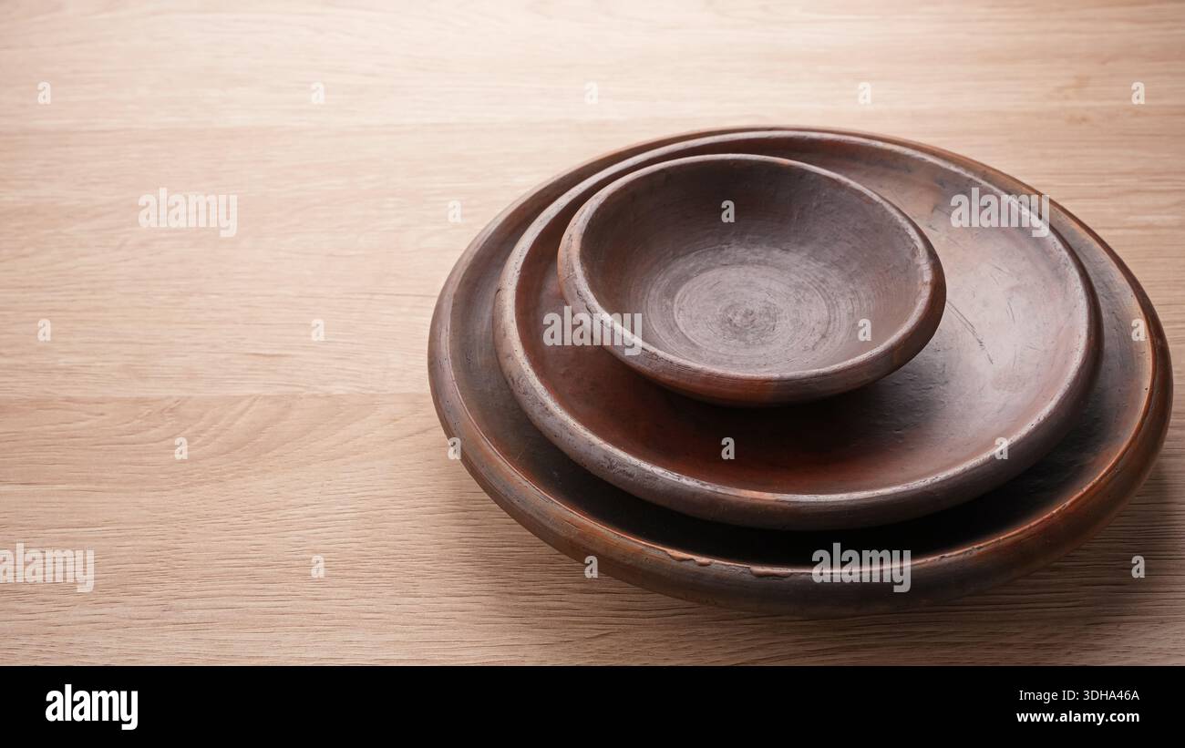 Empty round clay plate, Indonesian pottery Stock Photo