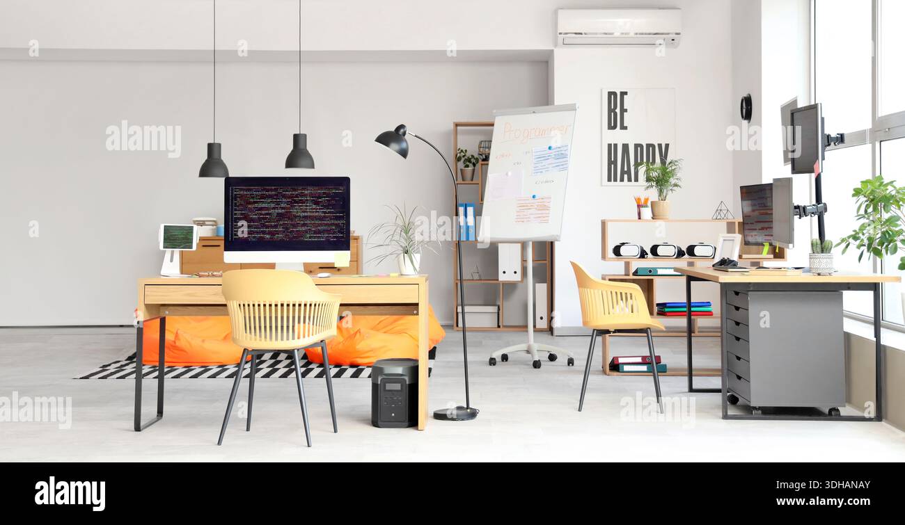 Interior of light programmer's office with modern workplaces Stock ...