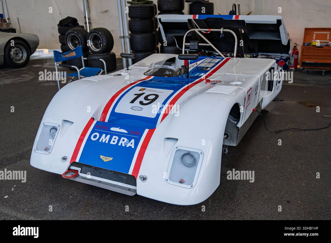 A front view of a classic 1971 Chevron B19 race car, in white with blue ...