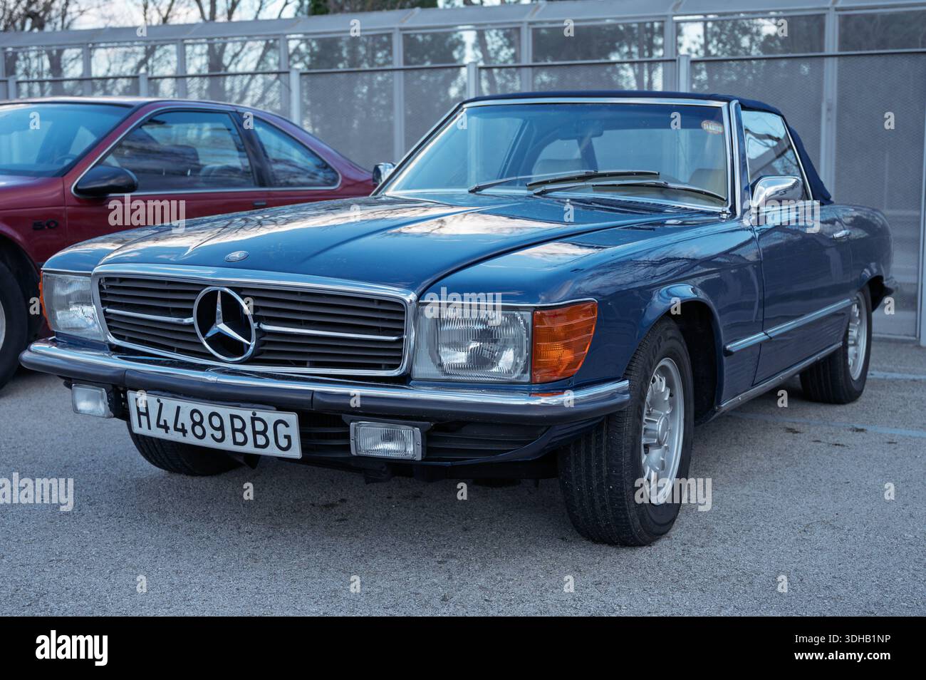 Front view of a luxurious blue Mercedes-Benz 350SL (R107), a