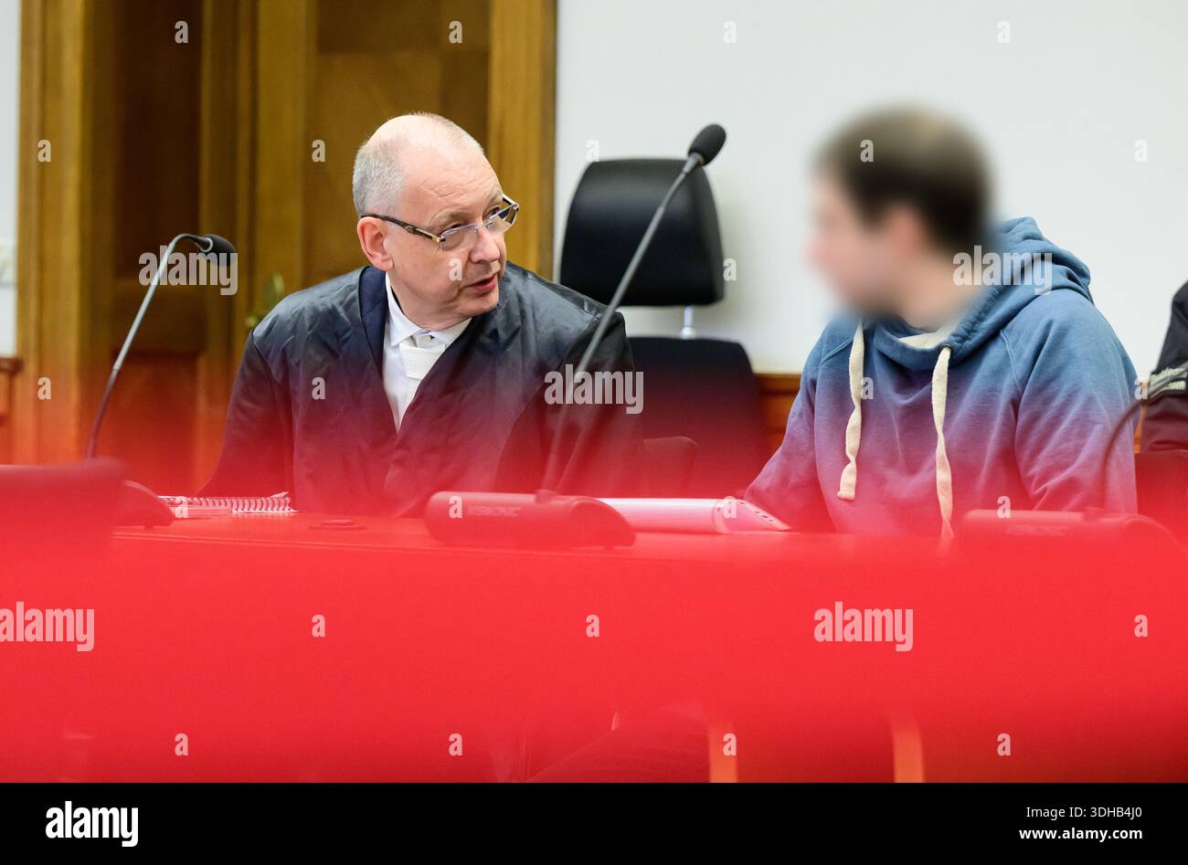 21 January 2026, Lower Saxony, Lüneburg: One of the two defendants (r ...