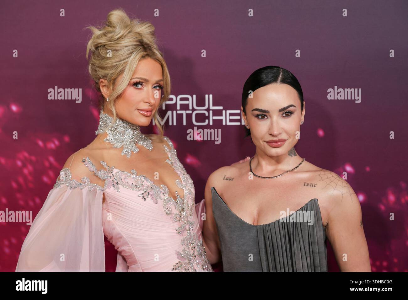 Paris Hilton, left, and Demi Lovato arrive at the world premiere of ...