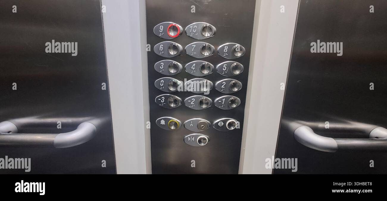 Modern elevator control panel with illuminated buttons, indicating ...