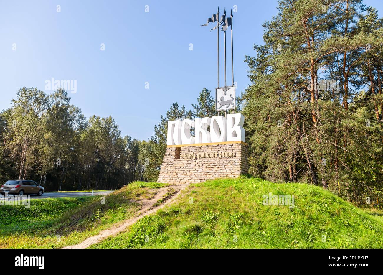 Pskov, Russia - August 30, 2024: Stele at the entrance to the old Russian city of Pskov. It contains the name and emblem of city Stock Photo