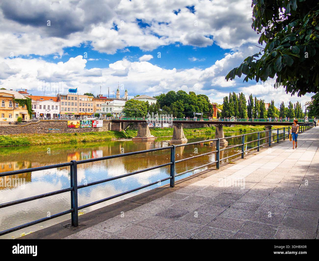 uzhhorod, ukraine - 29 jun, 2007: river uzh on a summer day. uzhhorod city travel background. panoramic view of a historic cityscape with bridge over Stock Photo