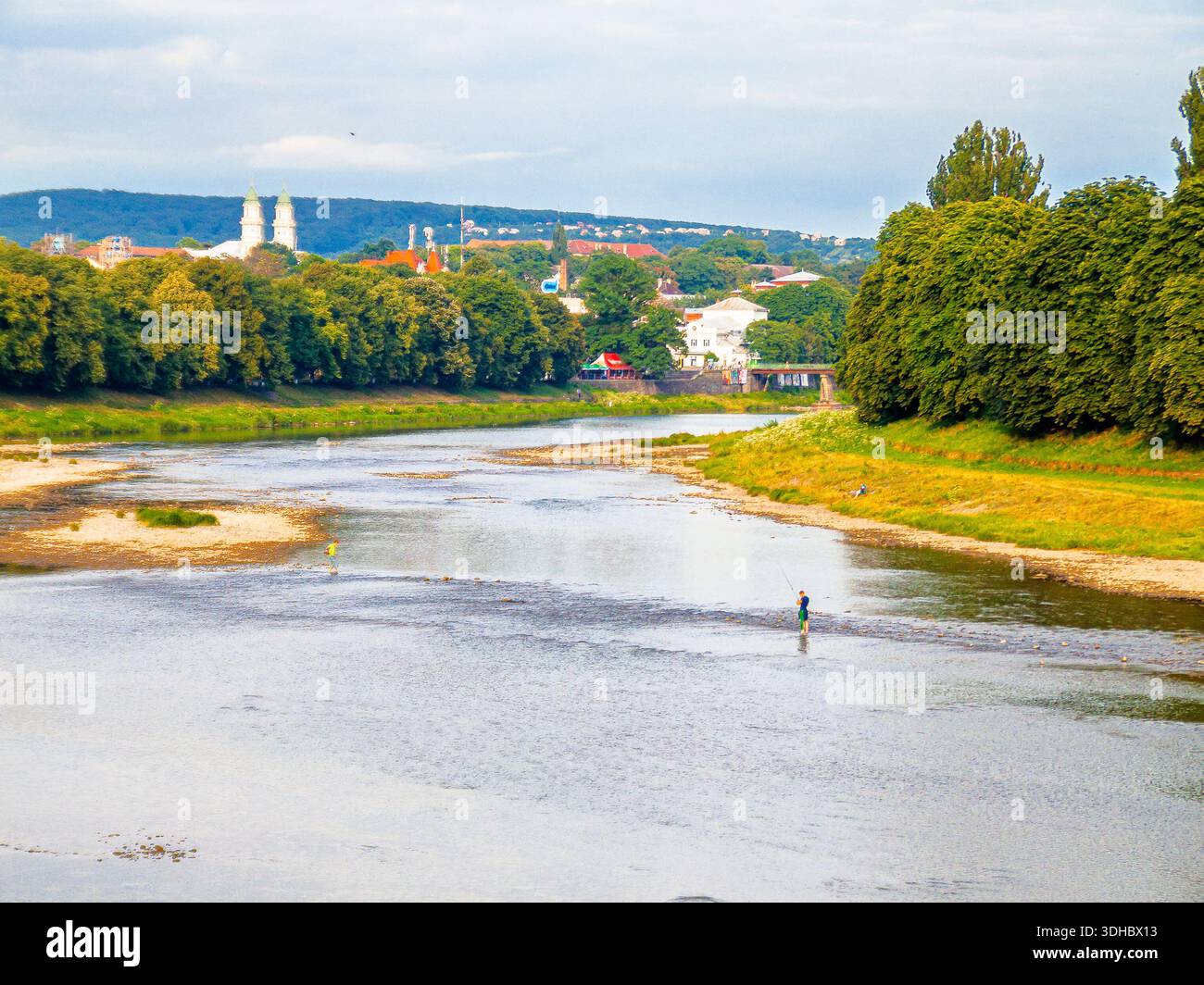 uzhhorod, ukraine - 29 jun, 2007: river uzh on a summer day. uzhhorod city travel background. panoramic view of a historic cityscape with bridge over Stock Photo