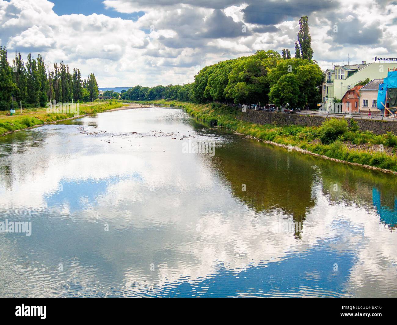 uzhhorod, ukraine - 29 jun, 2007: river uzh on a summer day. uzhhorod city travel background. panoramic view of a historic cityscape with bridge over Stock Photo