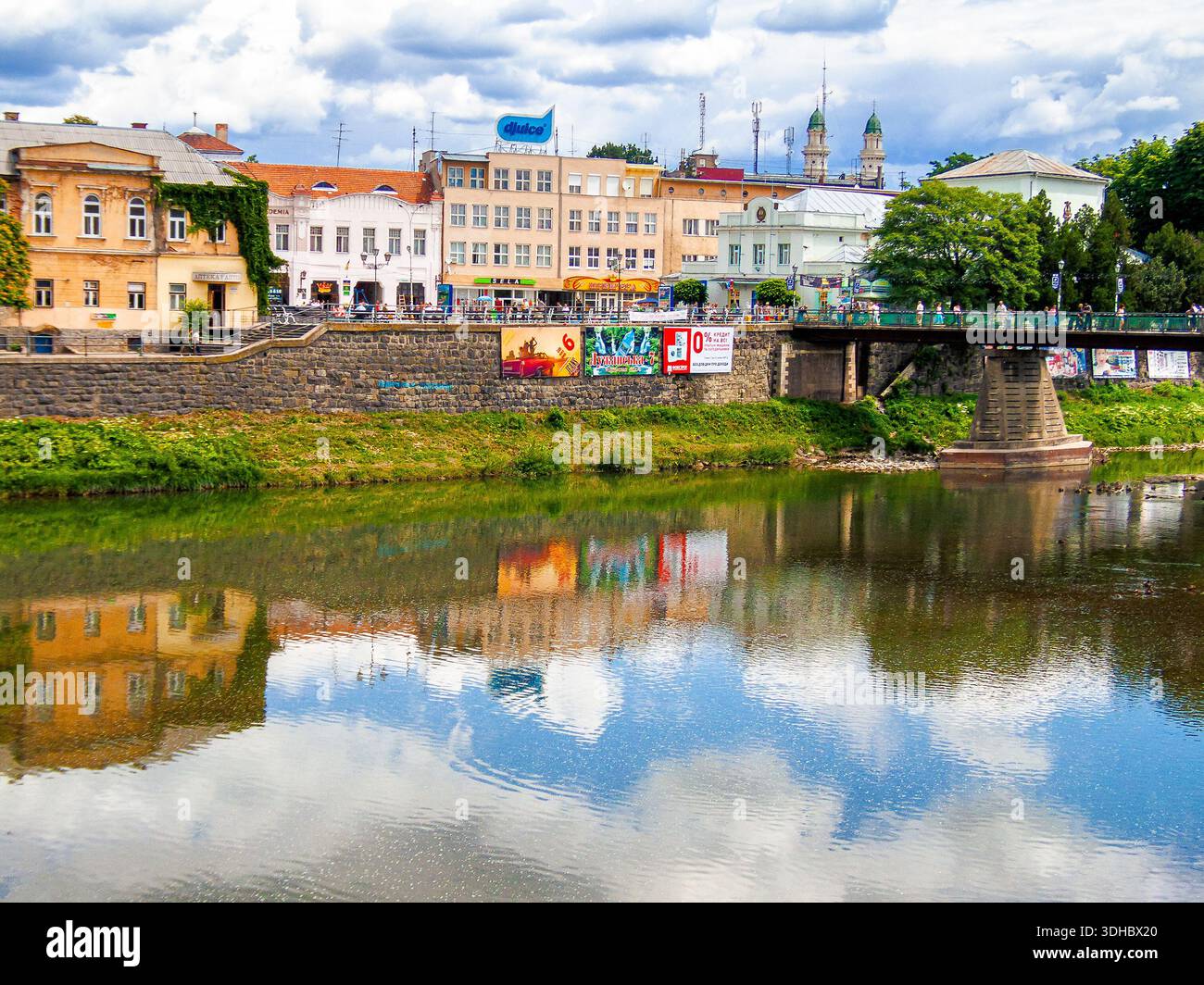 uzhhorod, ukraine - 29 jun, 2007: river uzh on a summer day. uzhhorod city travel background. panoramic view of a historic cityscape with bridge over Stock Photo