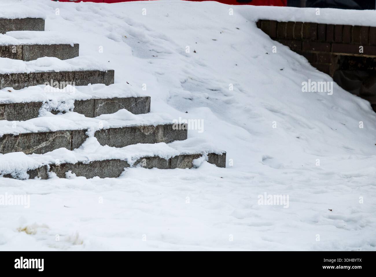 snow covered stone steps and ramp for the disabled in winter outdoor ...