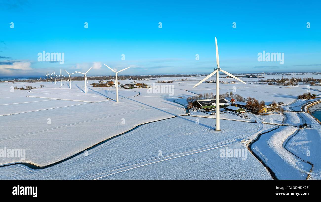 Wind turbines in a snowy rural landscape Stock Photo - Alamy