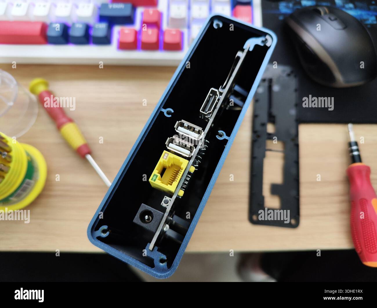 Open case of a compact computer with visible ports and components on a ...