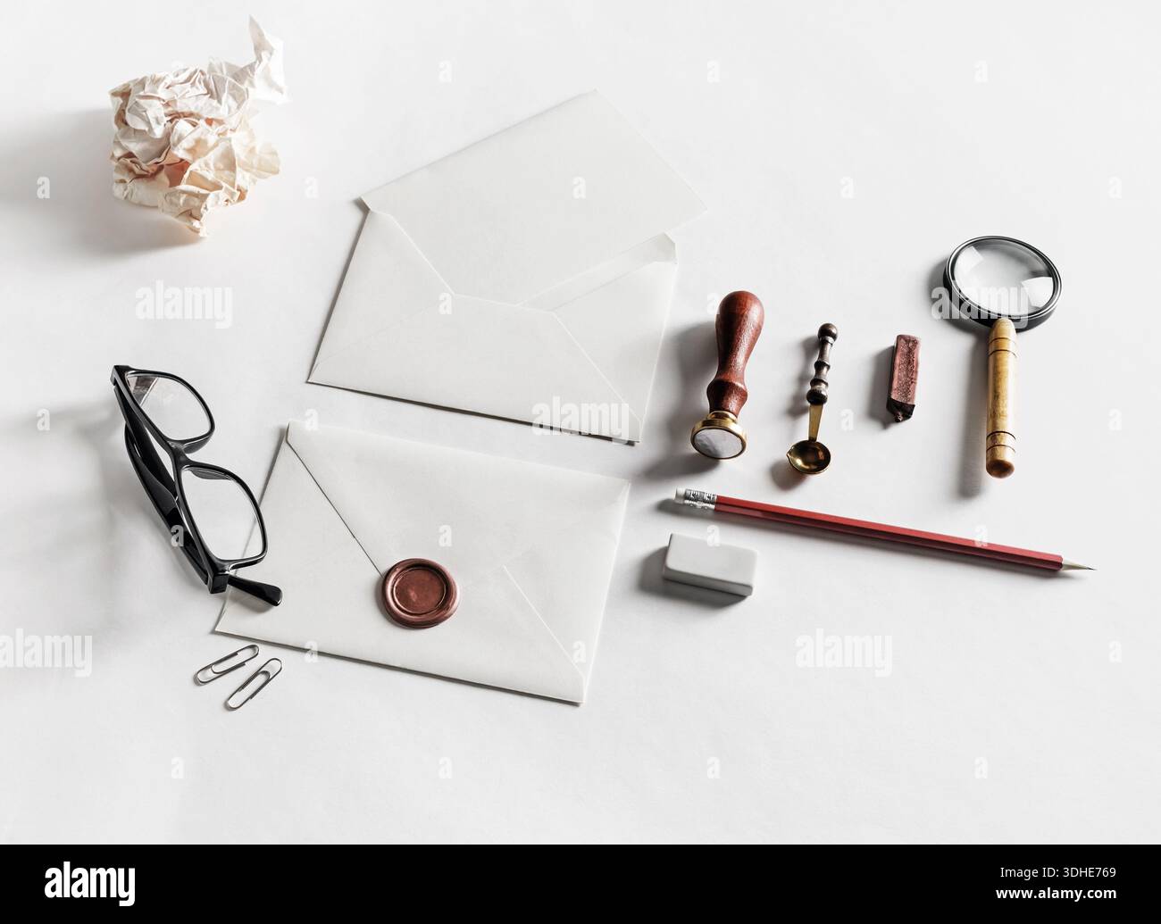 Blank stationery with envelopes on paper surface. Responsive design mockup. Stock Photo