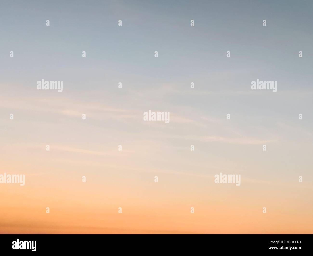 Soft Sunset Sky with Gradient Clouds at Dawn or Dusk Stock Photo