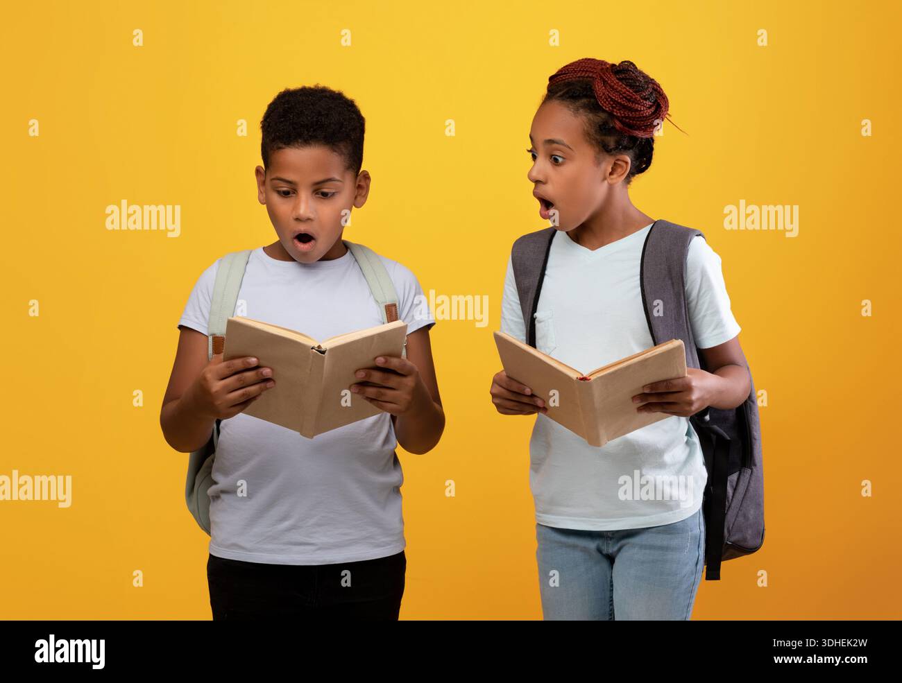 Excited african american boy and girl going to school Stock Photo - Alamy