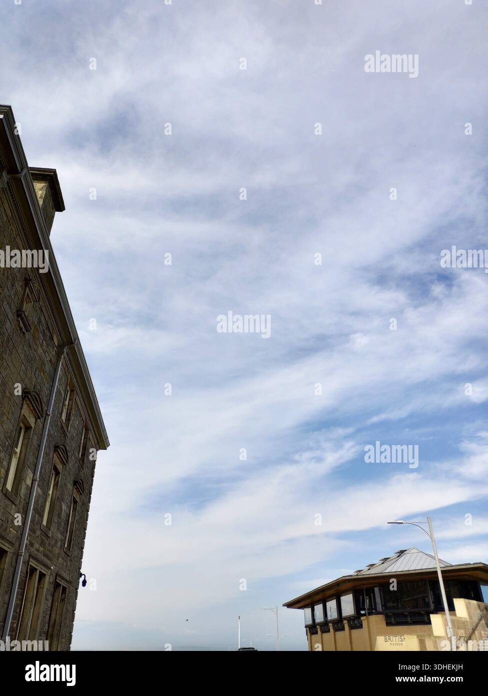 Historic buildings under a cloudy sky with architectural contrast Stock ...