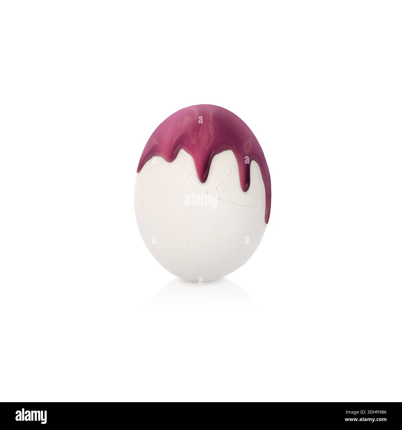 Paint dripping down egg on white background. Easter celebration Stock Photo