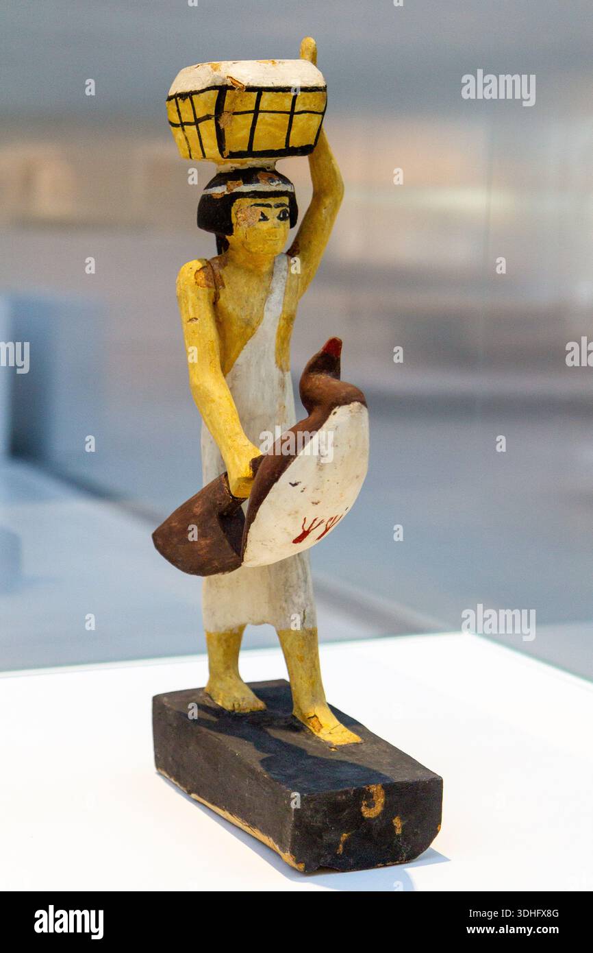 Offering bearer. Around 1950BC. Tempera on wood. Found in Asyut, Egypt. The Louvre Museum in Lens, France. - Stock Image