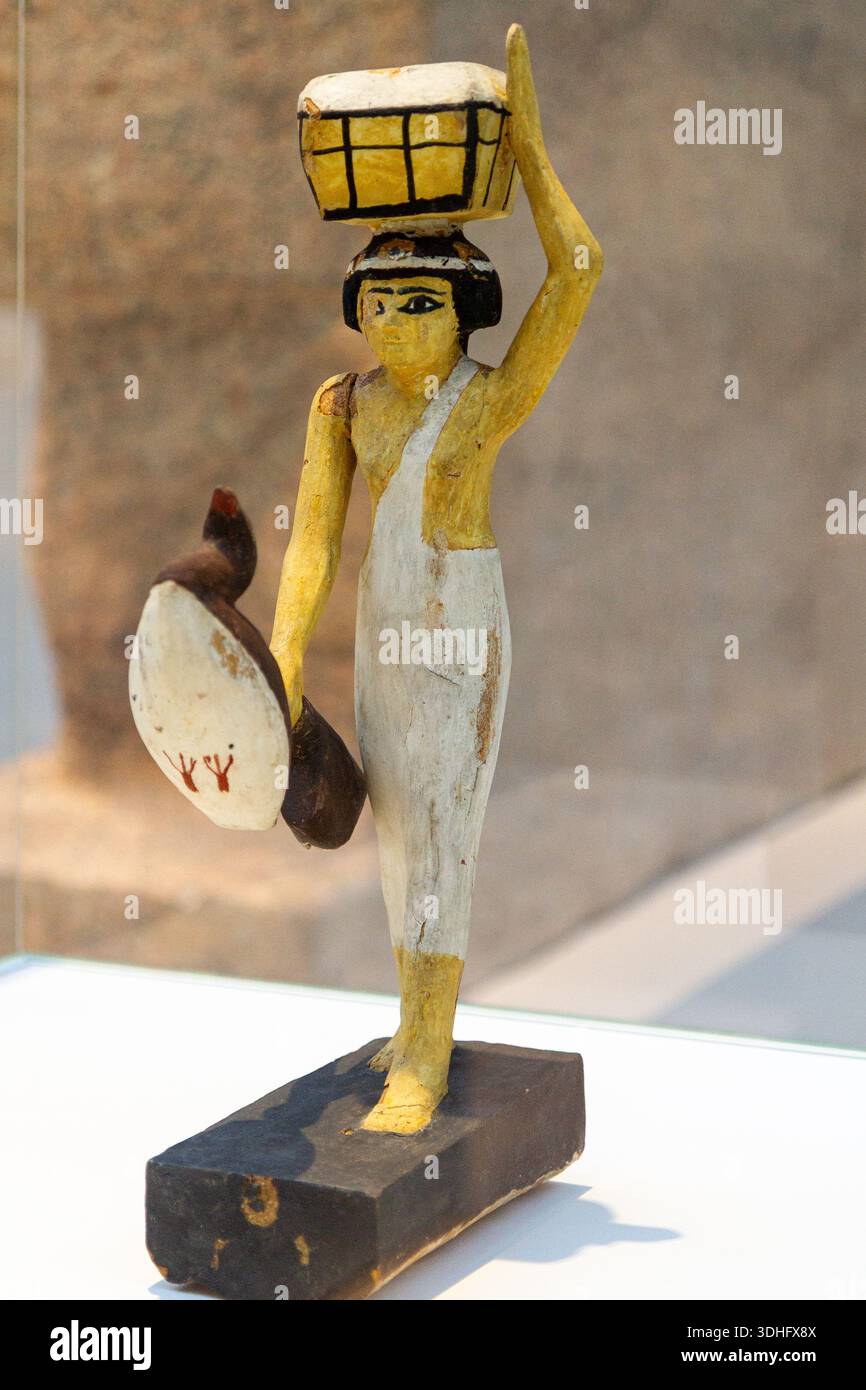 Offering bearer. Around 1950BC. Tempera on wood. Found in Asyut, Egypt. The Louvre Museum in Lens, France. - Stock Image