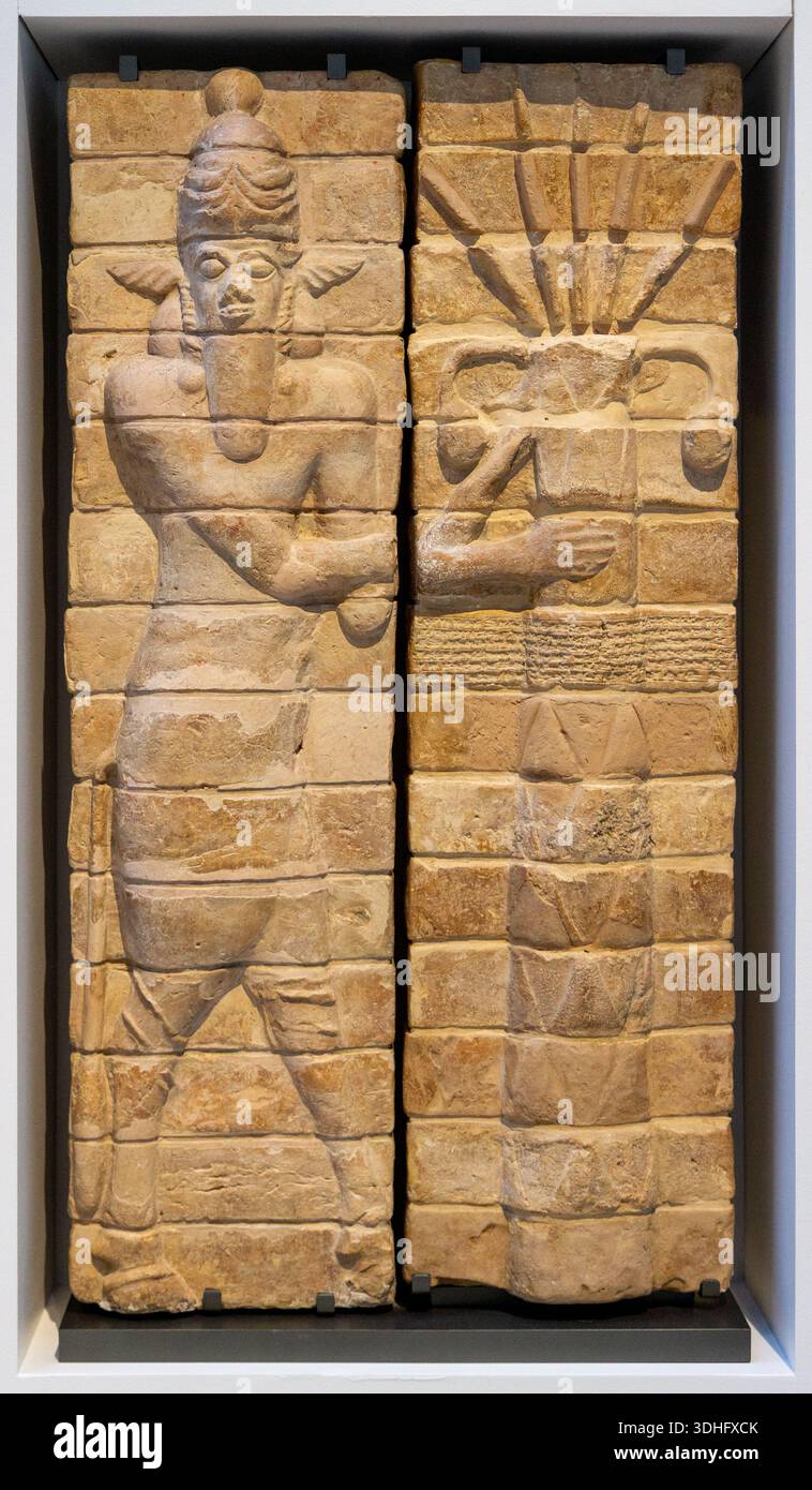 Fragments of decoration from the temple of Inshushinak, tutelary god of Susa: bull-man and palm tree (symbol of fertility). Around 1150BC. Susa, Iran. - Stock Image