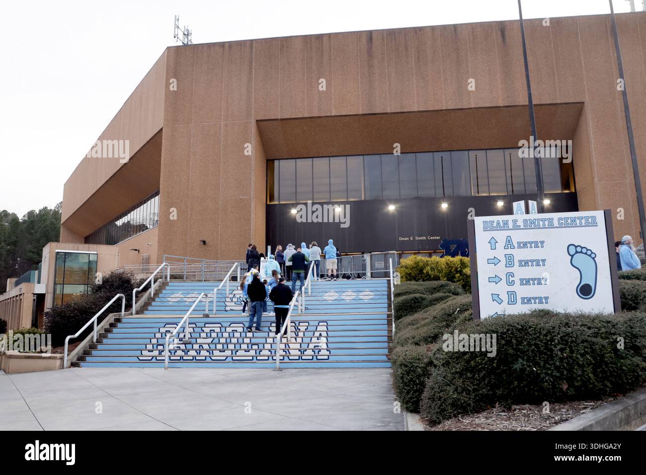 Fans line up as they wait to enter the Dean Smith Center before an NCAA ...
