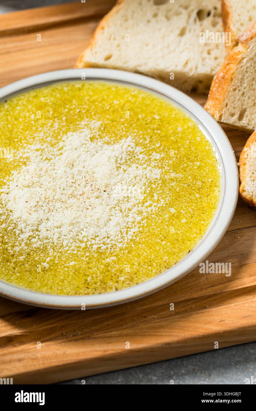 Homemade Dipping Olive Oil with Bread and Parmesan Cheese Stock Photo