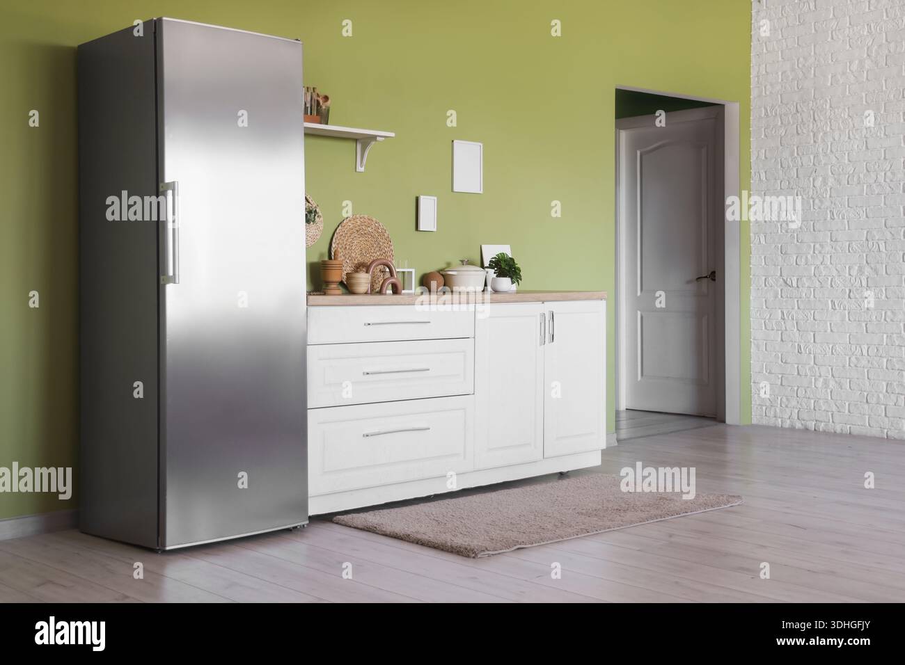 Interior of stylish kitchen with modern fridge and counters Stock Photo ...