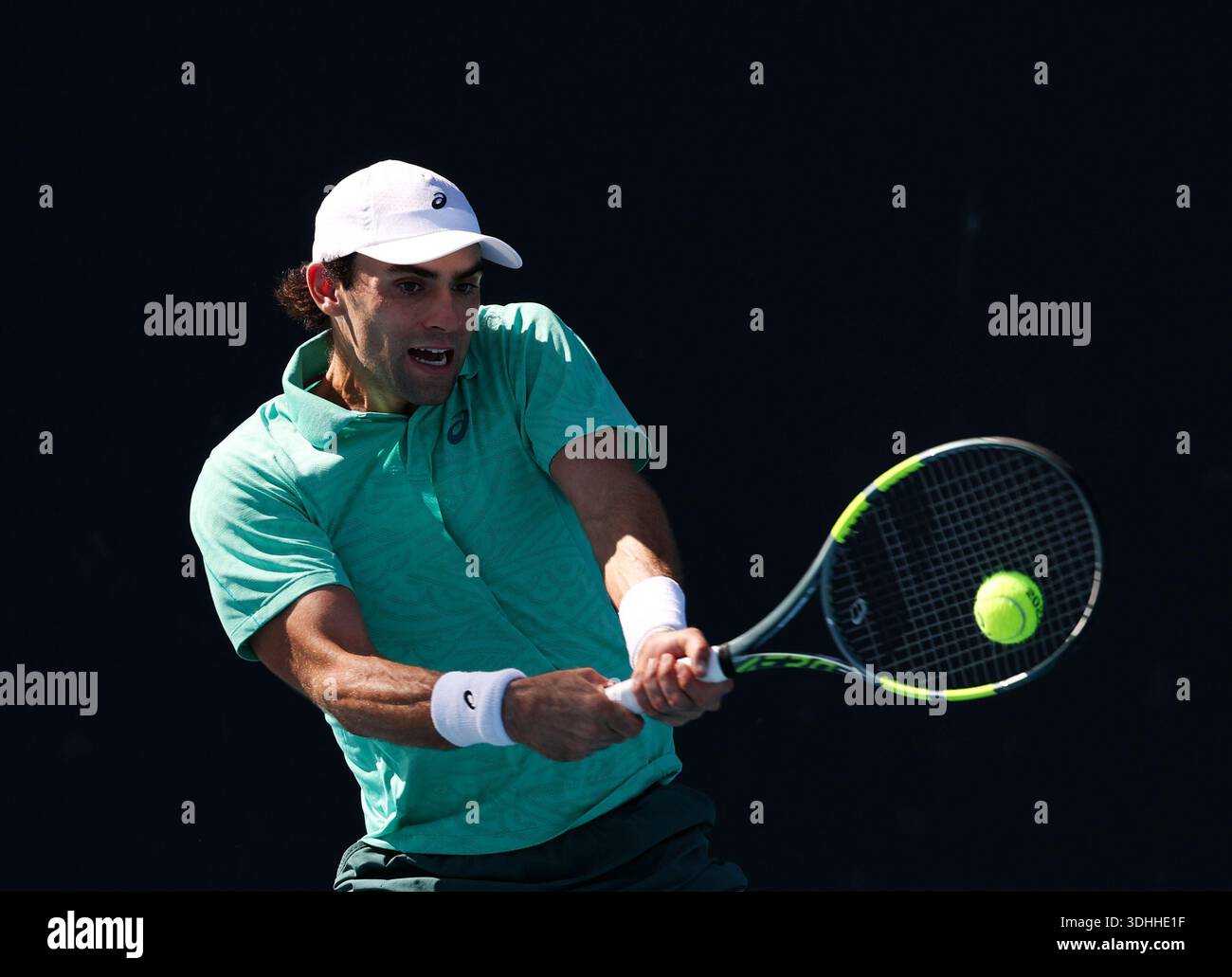 Melbourne, Australia. 22nd Jan, 2026. Eliot Spizzirri hits a return during the men's singles 2nd round match between Wu Yibing of China and Eliot Spizzirri of the United States at the Australian Open tennis tournament in Melbourne, Australia, Jan. 22, 2026. Credit: Ma Ping/Xinhua/Alamy Live News Stock Photo
