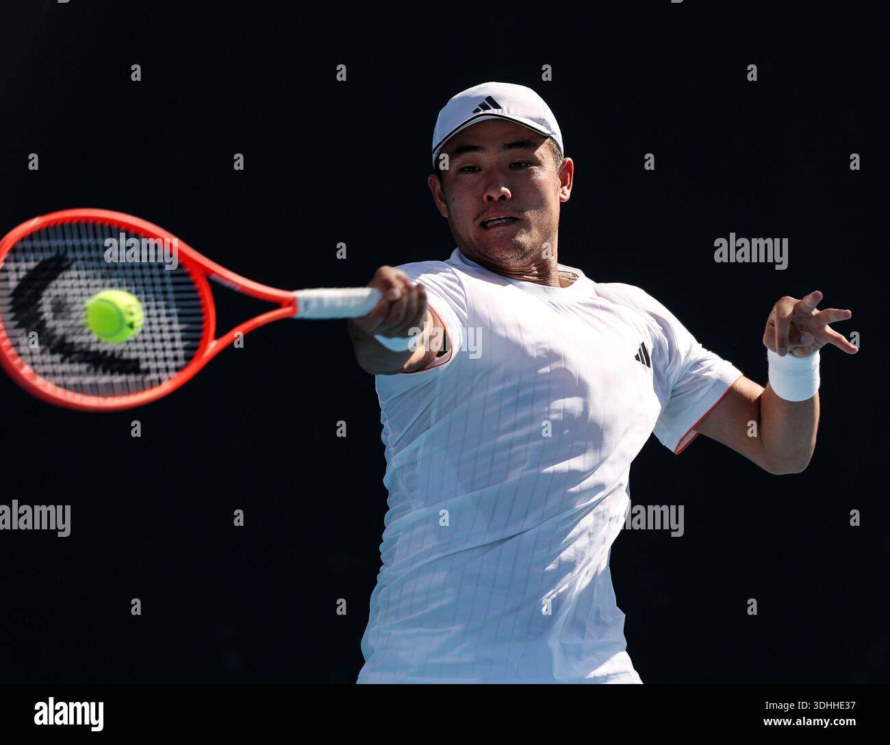 Melbourne, Australia. 22nd Jan, 2026. Wu Yibing hits a return during the men's singles 2nd round match between Wu Yibing of China and Eliot Spizzirri of the United States at the Australian Open tennis tournament in Melbourne, Australia, Jan. 22, 2026. Credit: Ma Ping/Xinhua/Alamy Live News Stock Photo