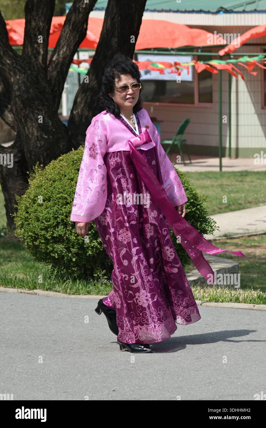 Pyongyang, North Korea - May 1, 2019: An adult woman in traditional korean  clothes hanbok or chosonot walking in the Taesongsan Funfair. Is an amuseme  Stock Photo - Alamy