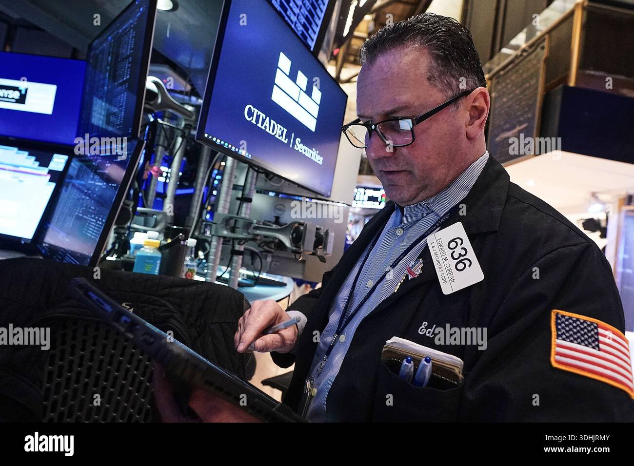 Trader Edward Curran Works On The Floor Of The New York Stock Exchange trader-edward-curran-works-on-the-floor-of-the-new-york-stock-exchange