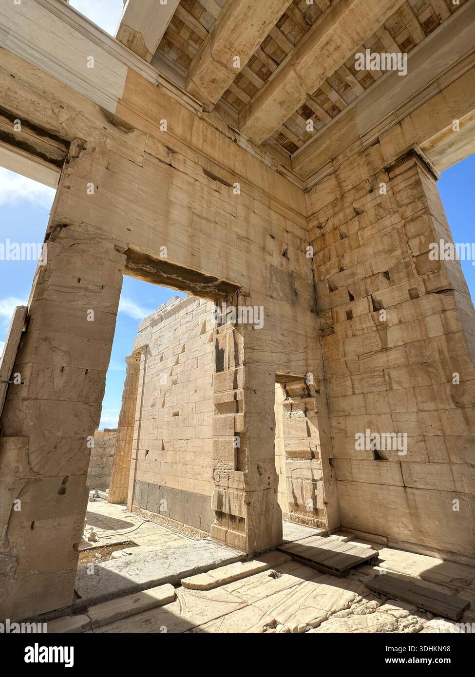Interior view of an ancient stone structure with doorway and dramatic ...