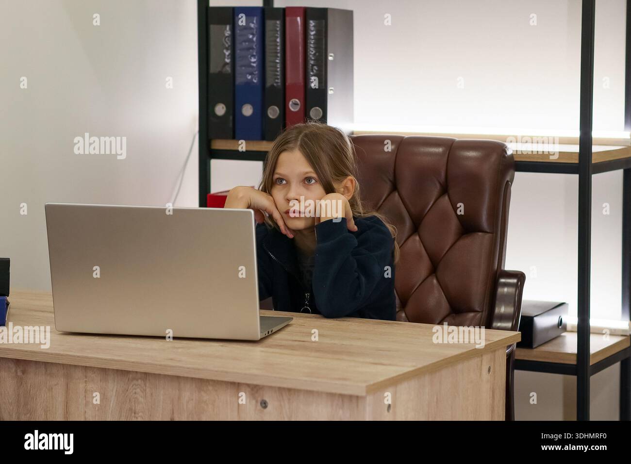 Preteen girl sits on wooden hi-res stock photography and images - Alamy