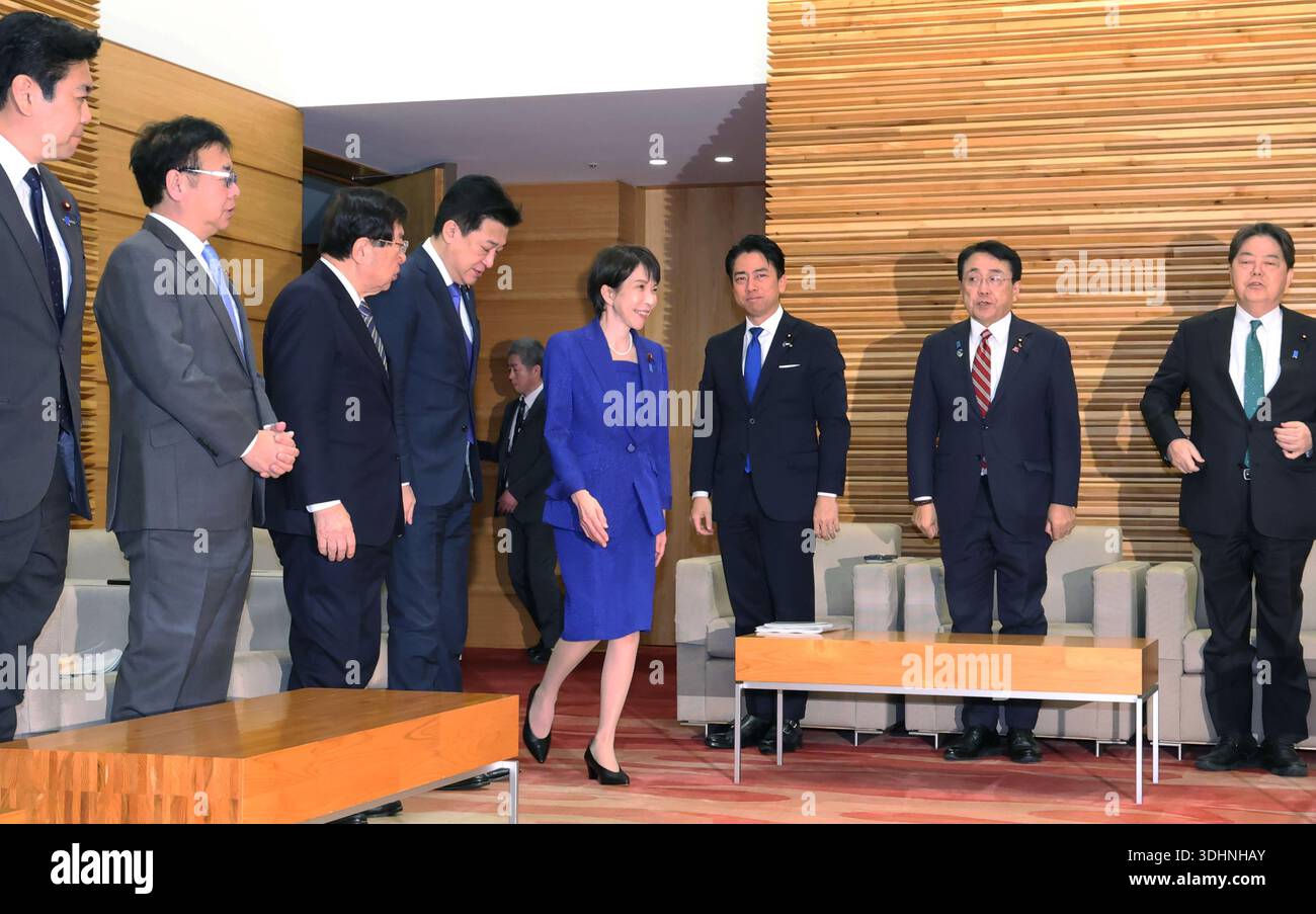 Japanese Prime Minister Sanae Takaichi (C) attends a cabinet meeting at ...
