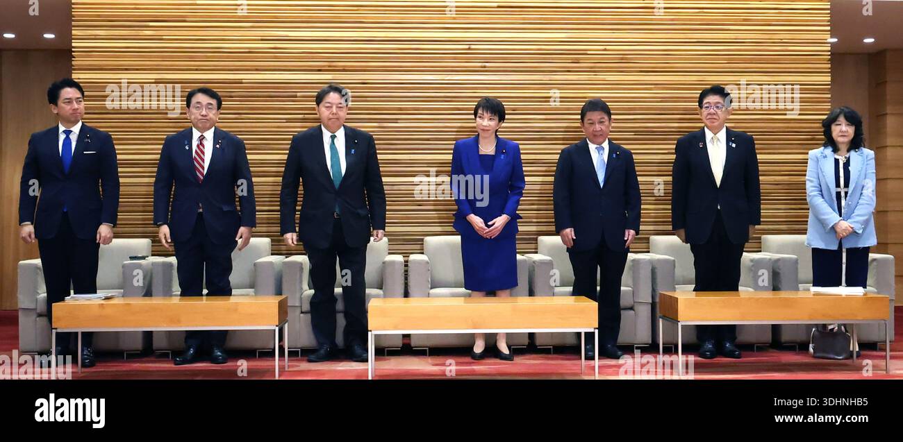 Japanese Prime Minister Sanae Takaichi (C) attends a cabinet meeting at ...
